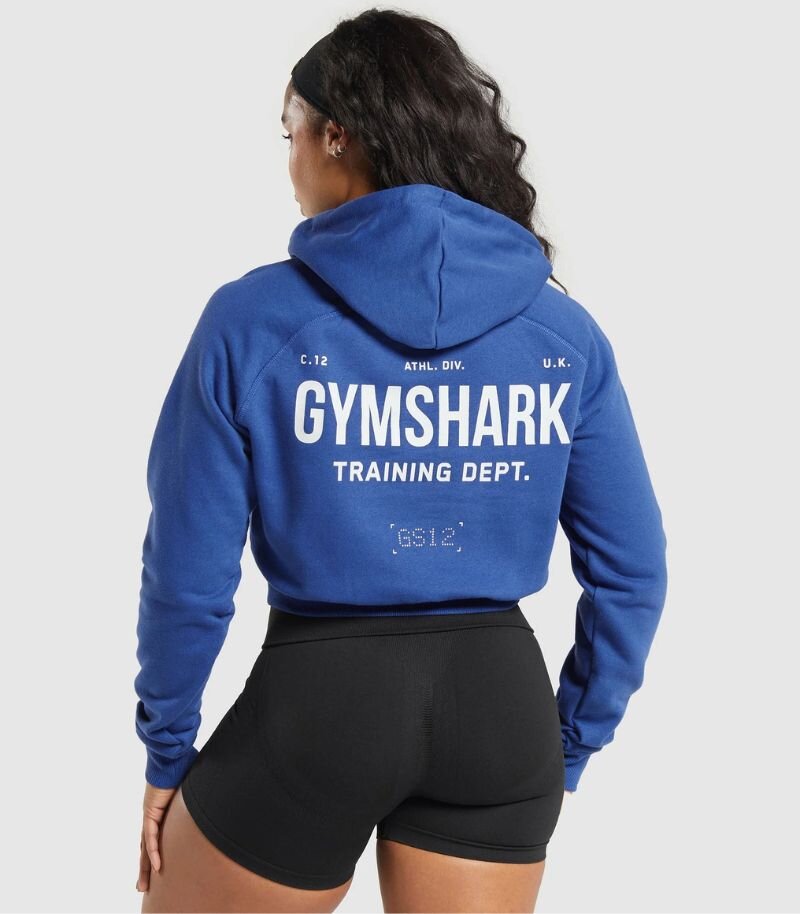 womens cropped blue gymshark hoodie with graphic design on back